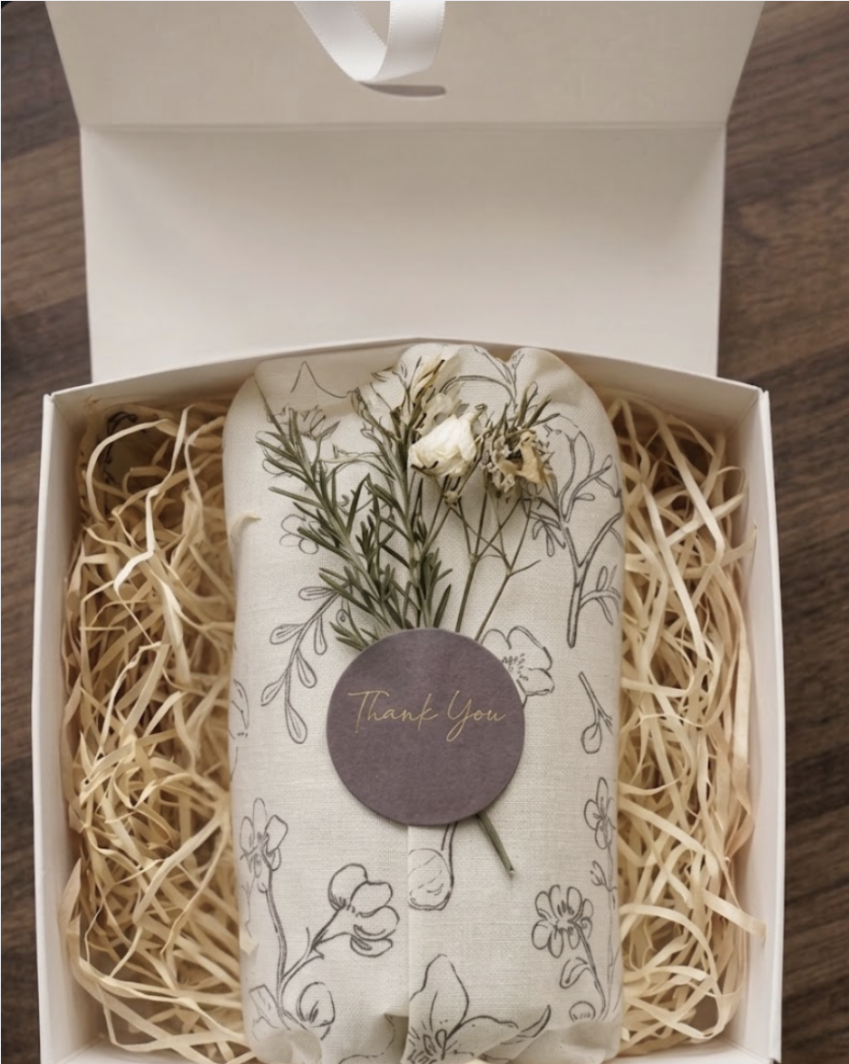 MYSA order wrapped in printed tissue with a Thank You seal and dried flowers